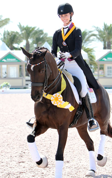 Caroline Roffman and Her Highness O celebrating individual bronze medal at the Wellington Nations Cup where the pair also won gold on the USA 1 team. © 2013 Ken Braddick/dressage-news.com 