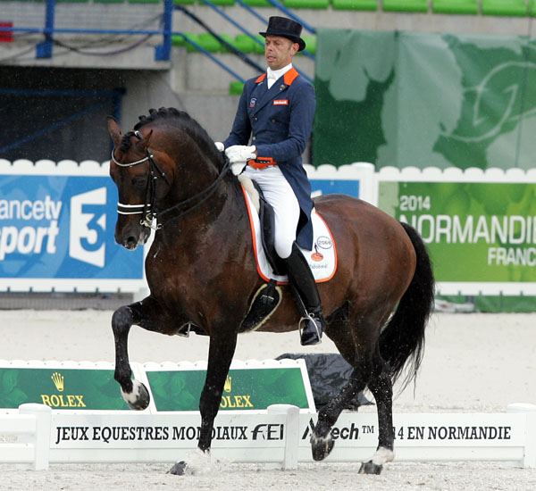 Hans Peter Minderhoud on Glock's Johnson TN dancing in the rain. © 2014 Ken Braddick/dressage-news.com