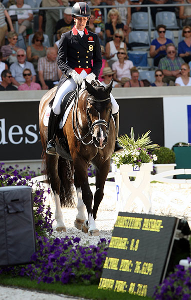 Charlotte and Valegro leaving arena after the CDIO5* Grand Prix at Aachen, Germany on July 17, 2014. The pair placed sixth on a score of 76.900 per cent and ended a run of 22 straight victories beginning in January 2012 after placing second behind Steffen Peters and Ravel in Florida. Three days later, July 20. Charlotte and Valegro were back on top winning the Freestyle starting another string of 18 victories until second place in the Grand Prix Special at the Olympic Games in Rio de Janeiro on Aug. 12, 2016. © 2014 Ken Braddick/dressage-news.com 